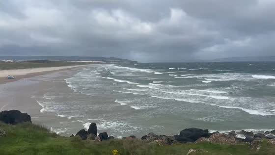 Strong coastal winds sweep the dunes in Portstewart, Ireland