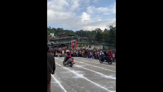 Woman wins slow motorcycle balancing contest in Sindhuli, Nepal