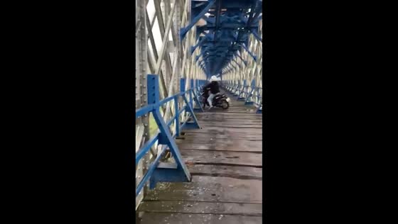 Motorcycle rider loses balance, hits the guardrail in Ciamis, Java, Indonesia