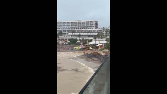 Flash floods sweep away beach furniture at a resort in Rhodes, Greece