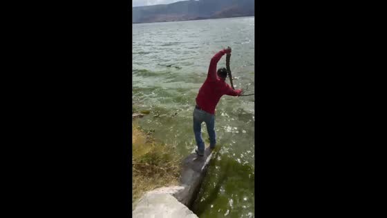 Man slips into Laguna de Cajititlán in Tlajomulco de Zuniga, Jalisco, Mexico