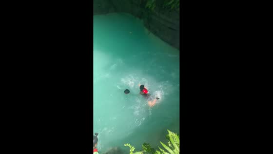 Woman falls straight into the water instead of jumping in Cebu, Philippines