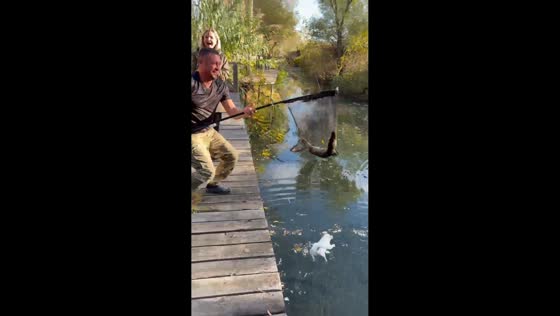 Dog slips into pond during fishing mishap in Vylkove, Ukraine