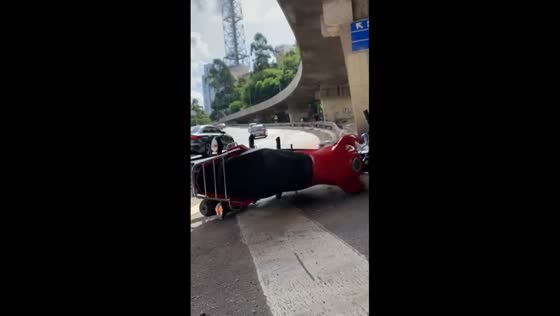 Motorbike rider hit by another vehicle on Paulista Avenue, Brazil