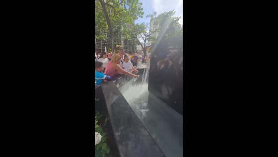 Devotees collect blessed water at José Gregorio Hernández fountain in Caracas, Venezuela