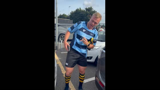 Rugby player smiles after suffering finger injury during match in London, UK