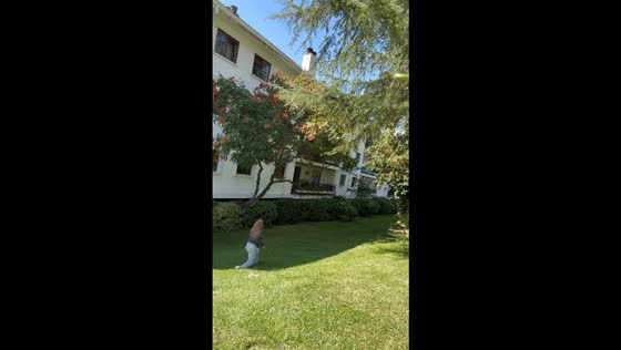 Woman tumbles down a hill and chases her dog after it runs away in Madrid, Spain