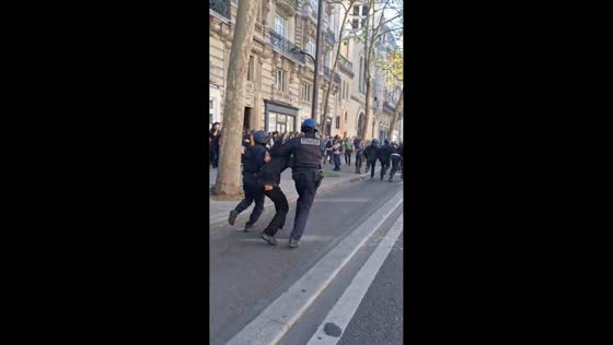 Police detain demonstrator amid student protest in Paris, France