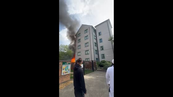 Fire erupts behind residential apartment block in Poplar, UK
