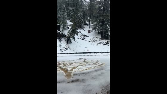 Heavy snow blankets mid-October storm in Wrightwood, California, USA