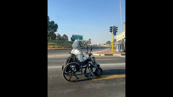 Wheelchair-turned-motorcycle speeds down Midrand highway