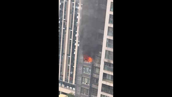 Apartment balcony fire sends smoke over residential complex in Sichuan, China