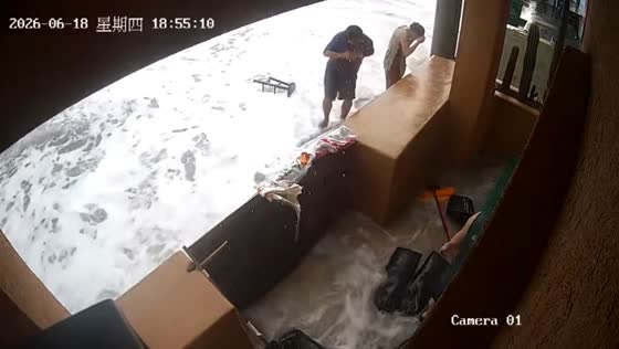 Powerful waves flood seaside shop on Weizhou Island in Guangxi, China