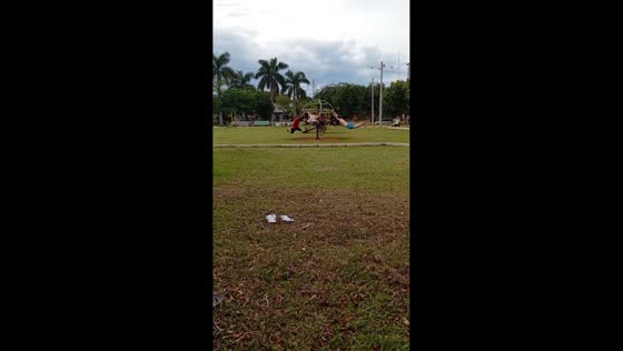 Friends spin on merry-go-round in Santa Rita, Paraguay