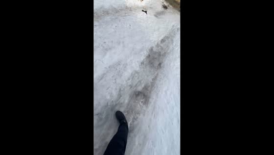 Man slips and tumbles on icy pathway in Makhachkala, Russia