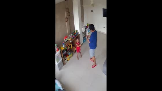 Father teaches son safe climbing skills in Davao, Philippines