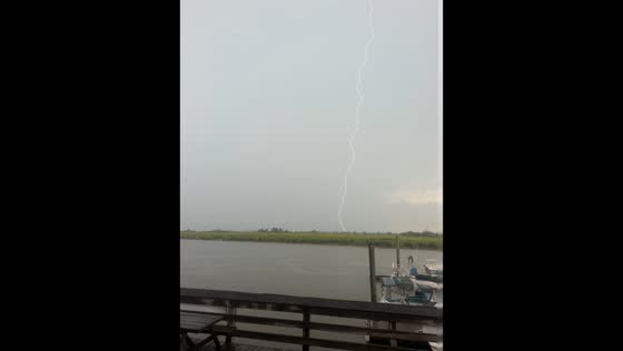 Dramatic lightning strike lights up stormy waterfront in Darien, USA