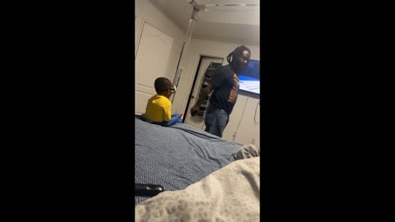 Baby makes funny Minion face while watching TV in Florida, USA