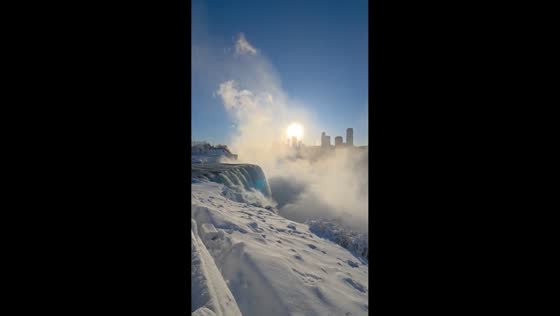 Golden winter sunlight over American Falls in Niagara Falls, New York, USA