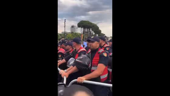 Protesters push against police barrier during demonstration in Tirane, Albania