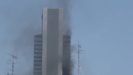 Fire erupts on upper floor of Torre Moeve skyscraper in Madrid, Spain  Description: