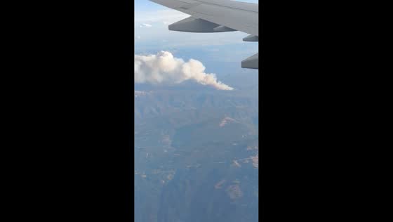 Massive wildfires seen from plane over Colorado mountains