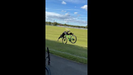 Boy falls off bicycle after landing on open field in Durham, England, UK