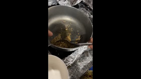Little girl mistakes lentils for popcorn in La Vega, Dominican Republic
