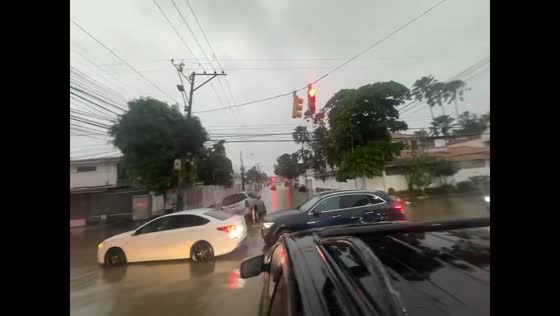 Severe flooding submerges streets and traps vehicles in Urdesa Central, Ecuador