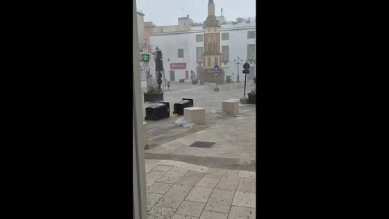 Heavy storm sends garbage bins floating through flooded streets in Casarano, Italy