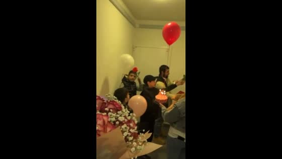 Child playfully pops balloon during surprise in Moscow, Russia
