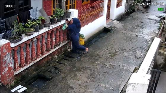 Woman slips into canal while walking home in Medan, Indonesia