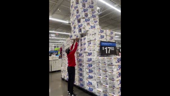 Man plays Jenga with a toilet paper tower in Los Angeles, USA