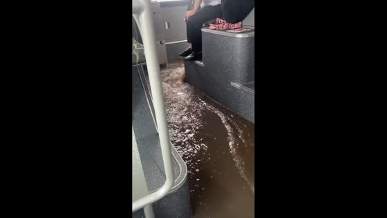 Flash flooding leaves bus inundated in Harbin, Heilongjiang, China