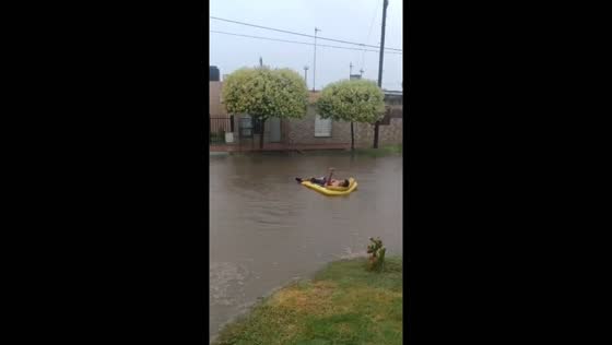 Flooded streets turn into fun waterways: Cordoba resident floats on flood water