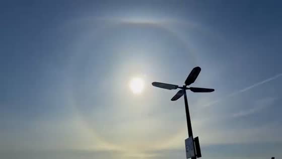 Solar halo forms above airport in Rochester, New York, USA