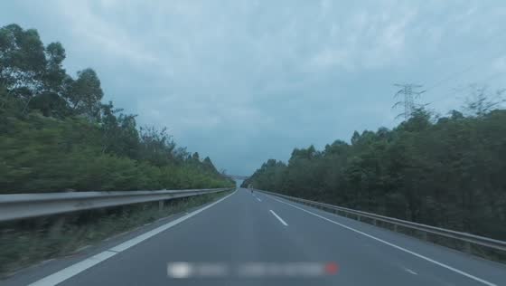 Motorcycle rider struggles to maintain control while speeding on the highway in Sichuan, China