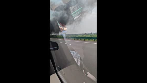 Car carrier truck catches fire on highway in Henan, China