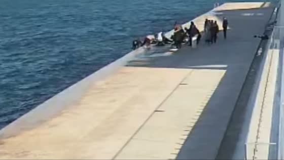 Teen rescued from icy sea by passersby in Sevastopol, Crimea, Russia