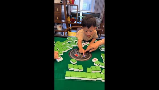 Boy startled by automatic mahjong table in Jiangsu, China