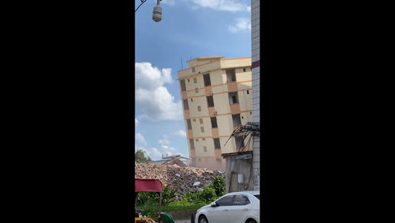 Building demolition mishap with excavator in Guangxi, China