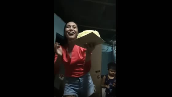 The birthday girl made fun of her cake by tossing it into the air and it did not fall!