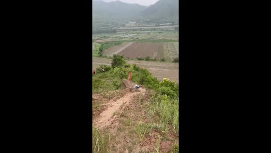 Girl slides down hill and ends up in the grass in Sichuan, China