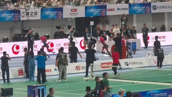 Humanoid robots sprint into safety barrier after 100-meter race in Beijing, China