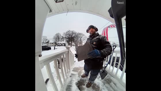 Frozen welcome mat snaps while clearing snow in Pompton Lakes, New Jersey, USA