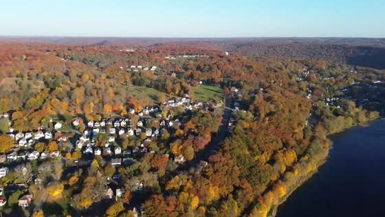 Vibrant autumn colors blanket Oil City's hills and river valley in Pennsylvania, USA