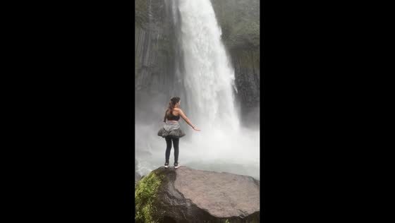 Woman hilariously struggles to pose near powerful Mindamora Falls in Bukidnon, Philippines