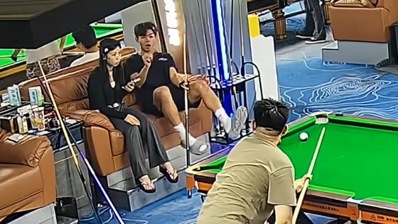 Man catches flying billiard ball before it hits his face in Fujian, China