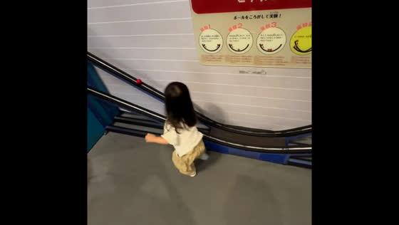 Toddler has fun chasing a ball in Osaka play area