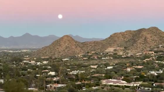 Desert sunset and cold moonrise create stunning view in Scottsdale, Arizona, USA